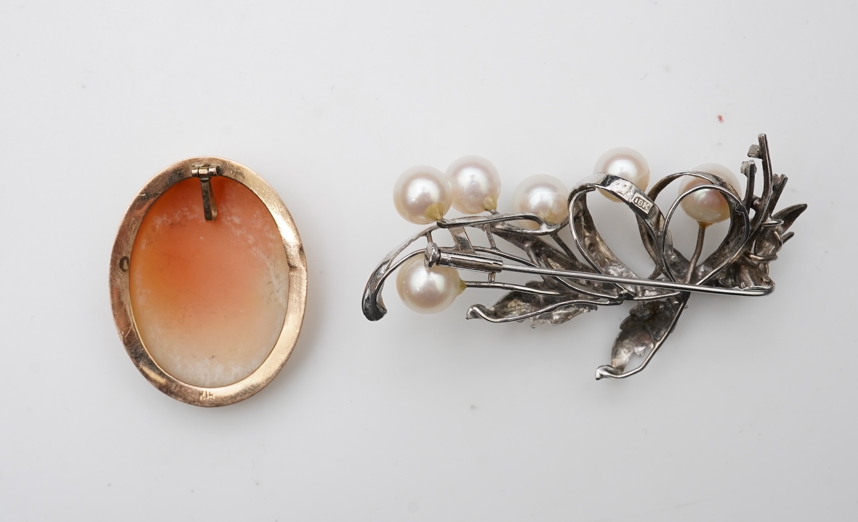 A collection of cultured pearl jewels and a cameo pendant